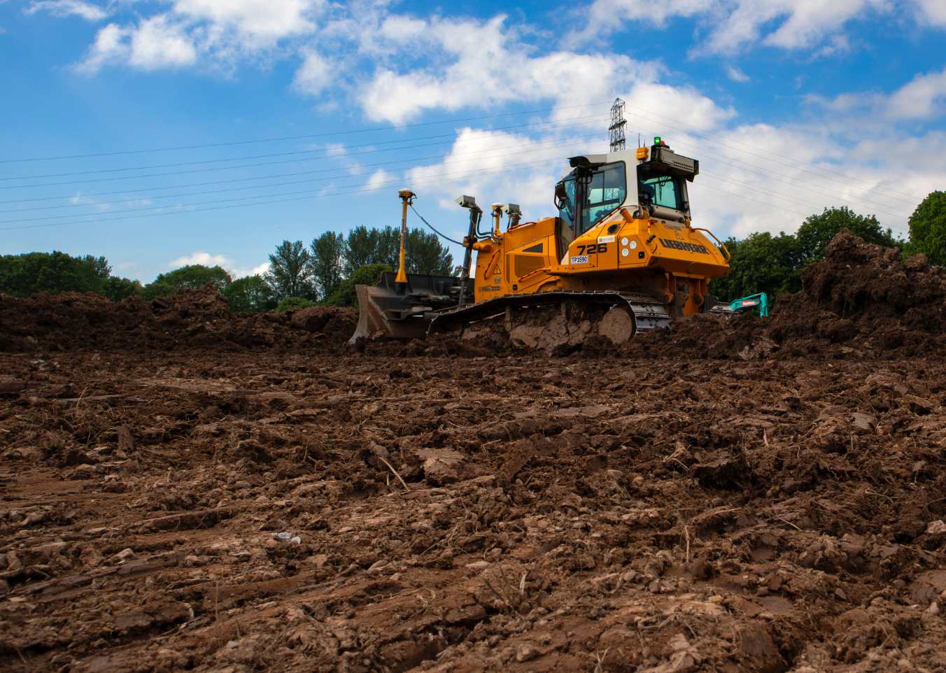 digger on top of dirt mount