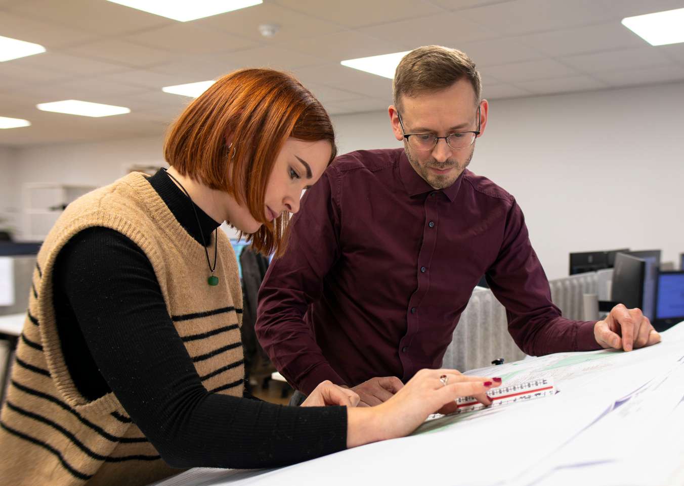 two people design and build contractor planning meeting