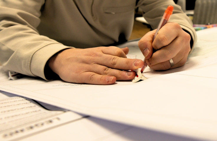 person's hands designing a project
