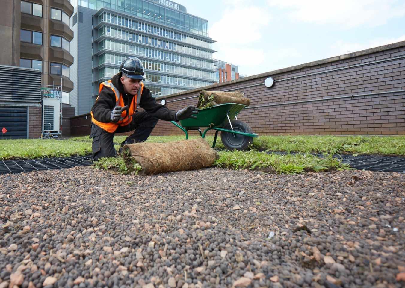 turf being laid on roof