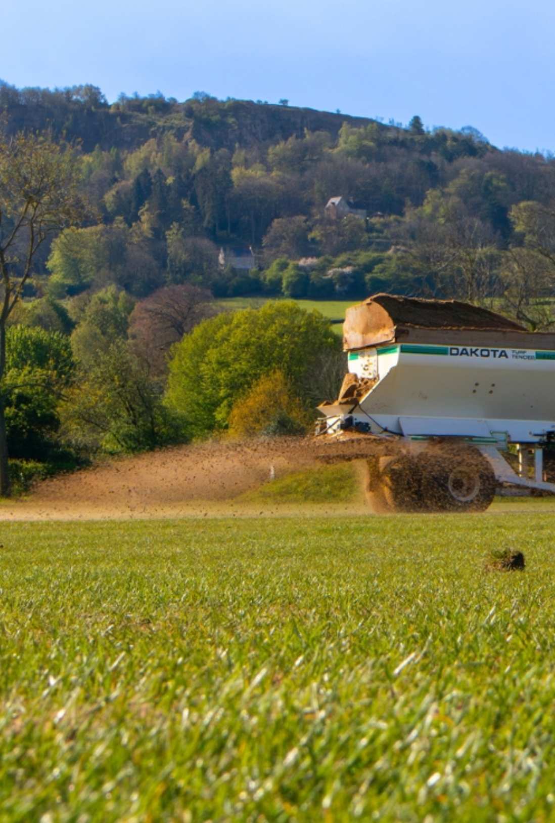 sports pitch maintenance carried out by tractor